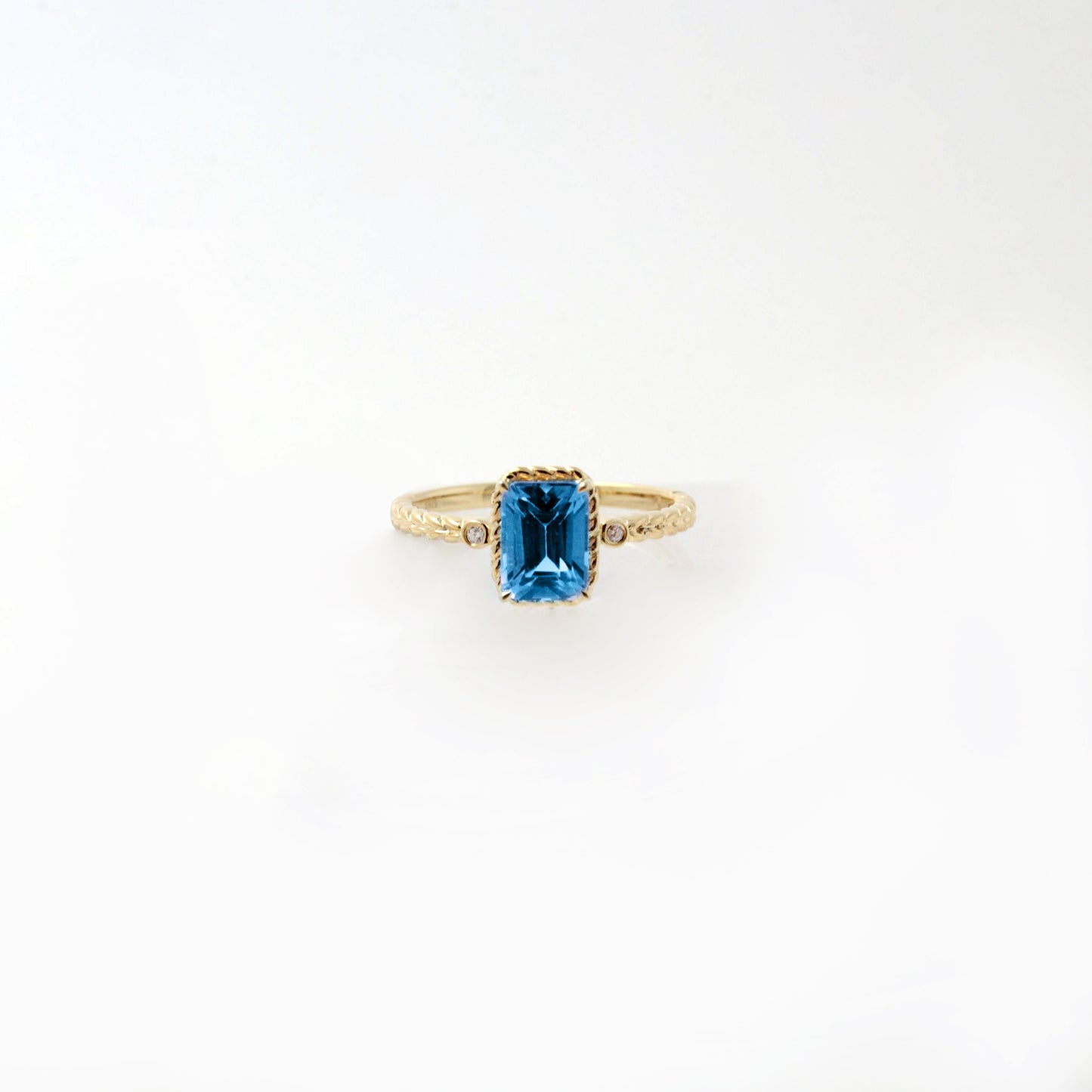Emerald Cut Swiss Blue Topaz Twist Ring