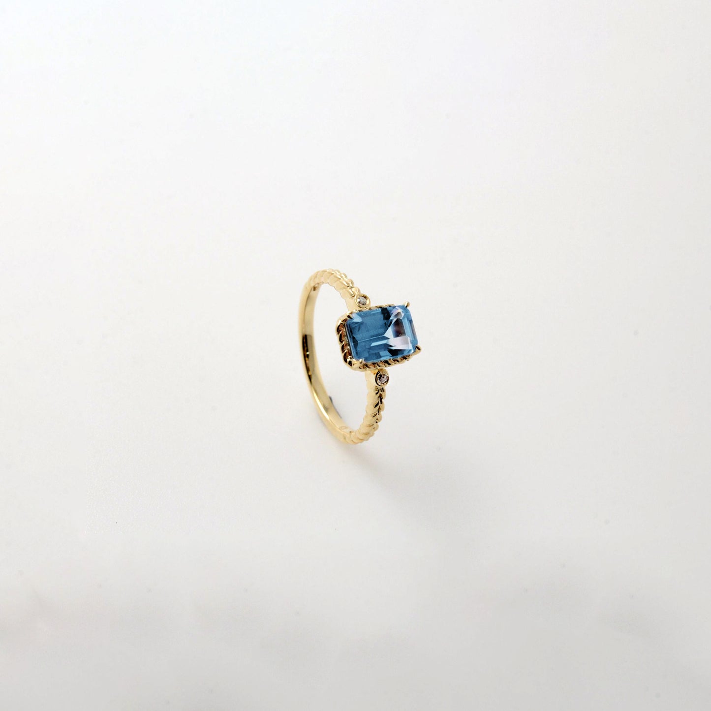 Emerald Cut Swiss Blue Topaz Twist Ring