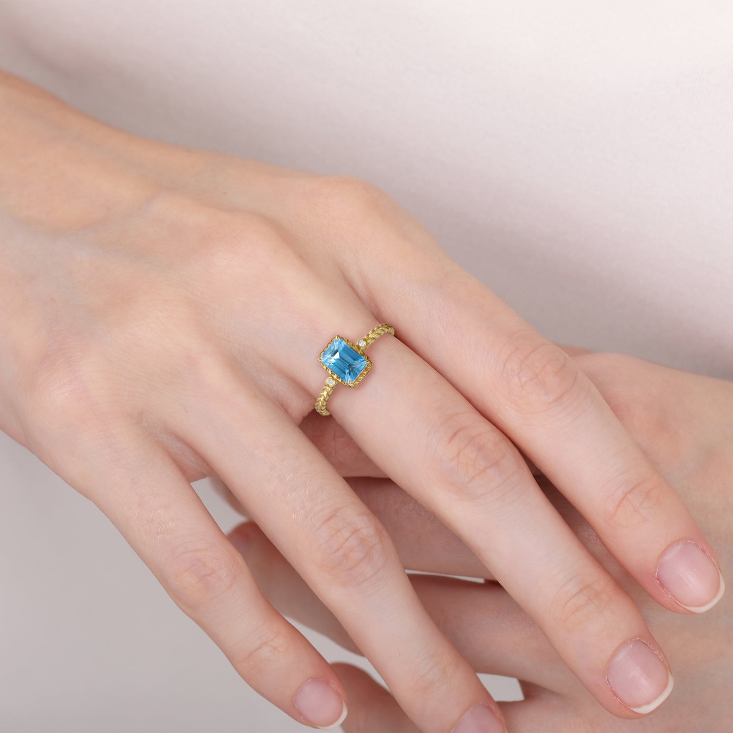 Emerald Cut Swiss Blue Topaz Twist Ring