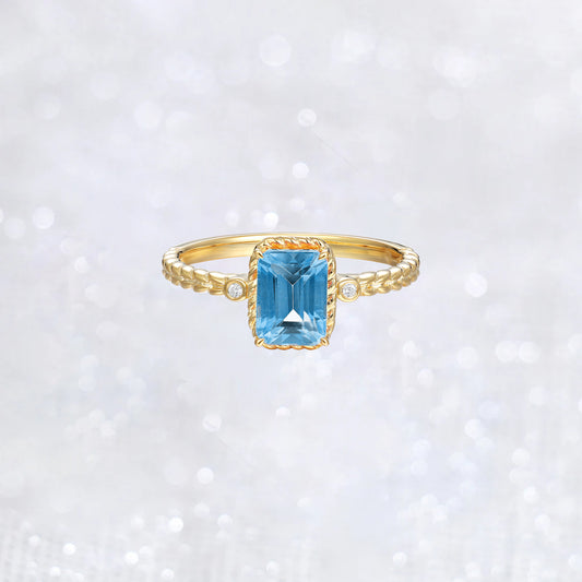 Emerald Cut Swiss Blue Topaz Twist Ring